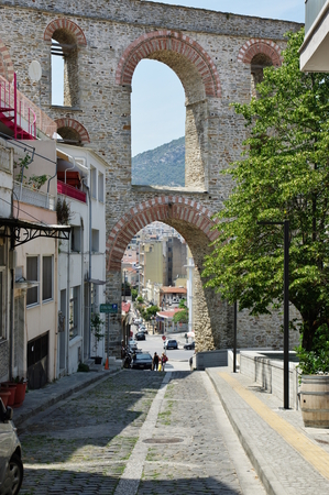 Kavala, a city in the northern Greece, in the Macedonia-Thrace region, located on the Aegean Sea. The road leading to the Byzantine citadel is located on the hill. In the background you can see a Roman aqueduct from the 16th century.のeditorial素材