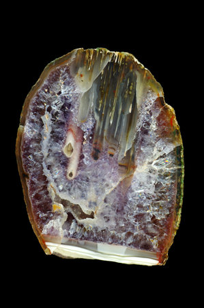 Silk-filled stalactite agate. Multicolored silica bands colored with metal oxides are visible....