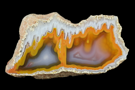 A cross section of the stalactite agate. Multicolored silica bands colored with metal oxides are visible.の写真素材