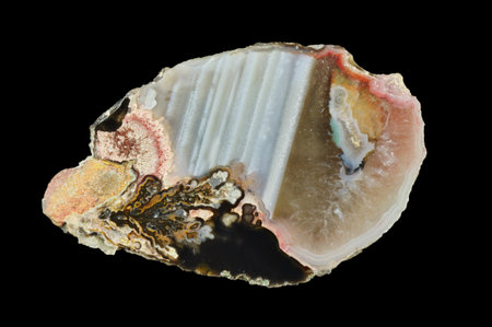 Horizontal agate, macro photography of the surface of the cut.  Multicolored silica bands colored...