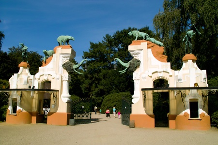 Gate with sculptures of people and animalsの写真素材