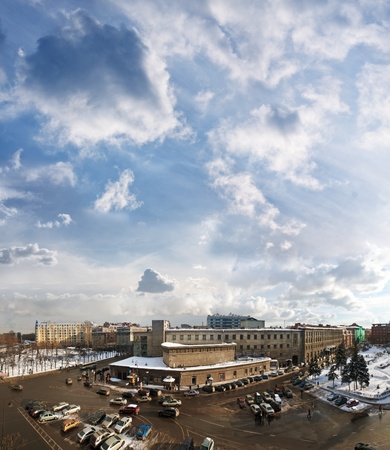 view from the height the crossroads with the cars in the city during the day, a cloudy skyの写真素材
