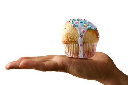 with glazed muffin on the palms, on a white background, isolatedの写真素材