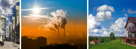 the juxtaposition of the city with the smoking factory chimneys and clean rural view with green lawn