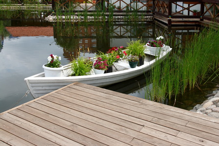 City Park. Boat with flowers on a pond.の写真素材