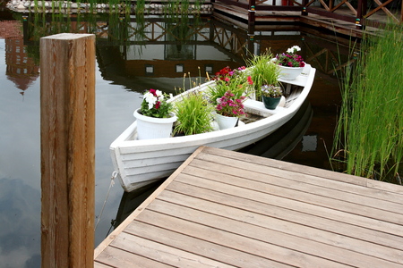 City Park. Boat with flowers on a pond.の写真素材