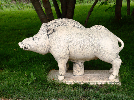 Sculpture of a wild boar in the Park.の写真素材