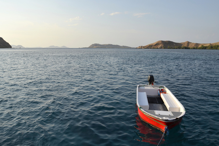 Views of the Bay. Boat with motor. There are no people. On the horizon are visible the island.の写真素材