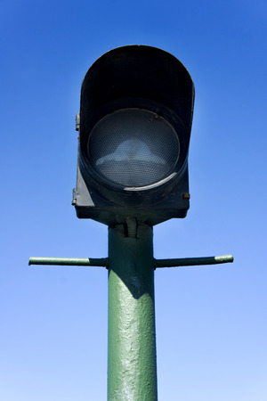 green street lamp post on blue sky backgroundの写真素材