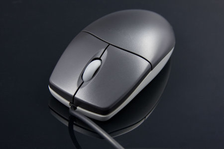 Computer Mouse with black background.