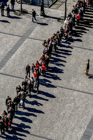 row of waiting people in front of centre pompitou, Paris