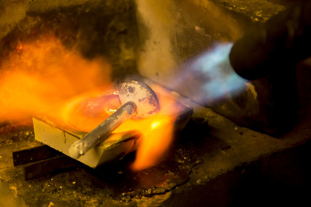 Melting of silver for a casting, melting of silver for a castの写真素材