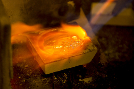 Melting of silver for a casting, melting of silver for a castの写真素材