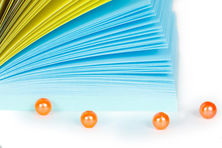 Paper records in block with orange beads