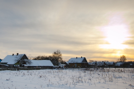 Winter rural landscape with sunsetの写真素材