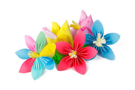 four colored paper flowers and flower with varicolored petalsの写真素材