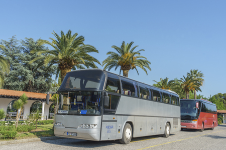 Budva, Montenegro, May, 09, 2016: tourist bus are parked on the parking near a hotelのeditorial素材