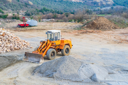 Bar, Zaljevo, Montenegro, February 17, 2019: Close-up image of an excavator working on the...