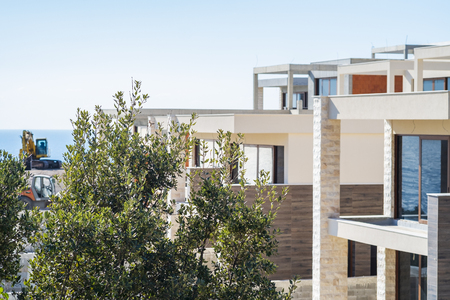 Construction site on a sunny spring day, the construction of a complex of villas on the Adriatic coast. View of an unfinished buildingのeditorial素材