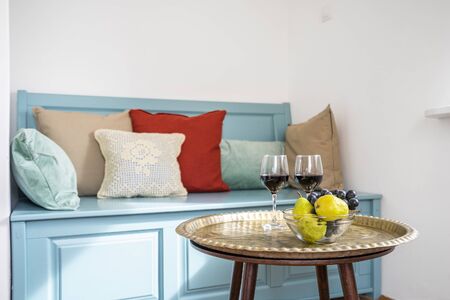 Image of a setup table with dessert, fruits, wine and glassesの写真素材