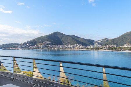 Budva, Montenegro, December, 06, 2019: Sea view from the hotel's spacious terrace on a Sunny day. The sea is blue, white clouds are visible in the sky, mountains in the distanceのeditorial素材