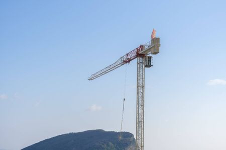 Budva, Montenegro, November 27, 2019: Construction of a multi-storey building in Budva, Montenegro. Crane is working on a construction siteのeditorial素材