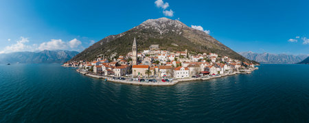 Panorama bird's eye view of small island in Adriatic sea, covered by greenery, traditional Balkan...