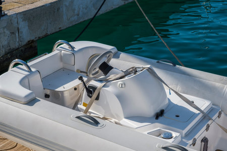 Close-up white rubber inflatable motor boat for tourism, travel and fishing, top view