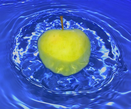 Apple in waterの写真素材