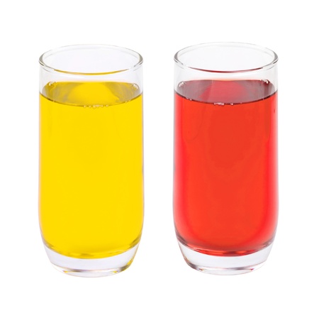 two glasses of apple and berry juice isolated on whiteの写真素材