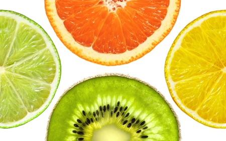 Orange, kiwi and lemon slices closeup isolated on a white backgroundの写真素材