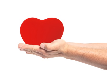 red heart in hands isolated on white backgroundの写真素材