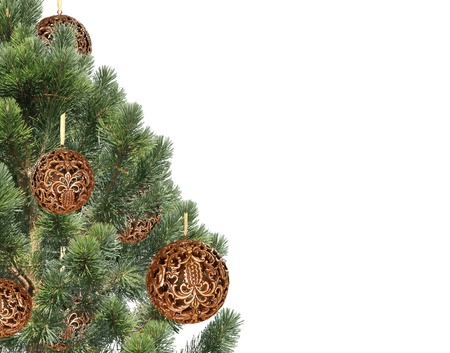 Christmas balls hanging with ribbons on fir tree over whiteの写真素材