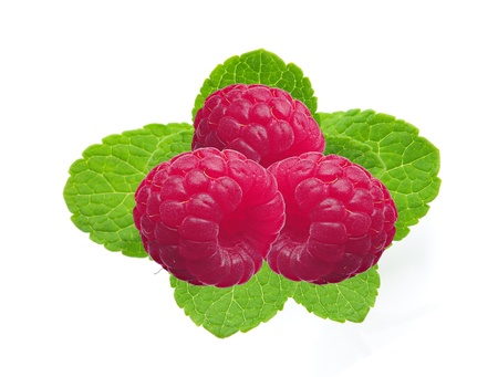 fresh raspberries with mint isolated on whiteの写真素材