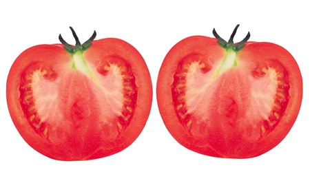 Two halves of red fresh tomato isolated on white backgroundの写真素材