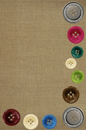 Bright sewing buttons on gray fabricの写真素材