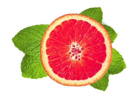 fresh grapefruit slice and leaves of mint isolated on white backgroundの写真素材
