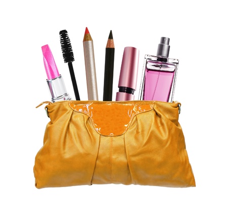 Beautiful golden makeup bag and cosmetics isolated on white の写真素材