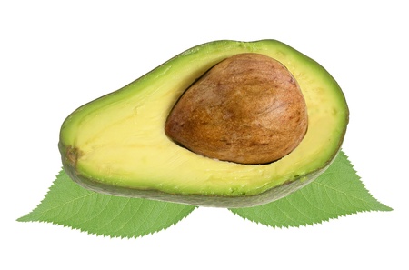 fresh avocado over green leaves isolated on white backgroundの写真素材