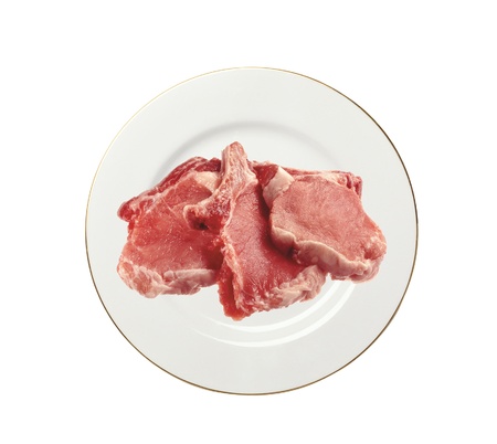 Raw meat on plate isolated on white backgroundの写真素材