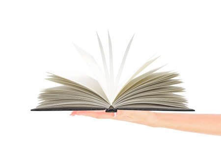 Woman hand holding opened book isolated on whiteの写真素材