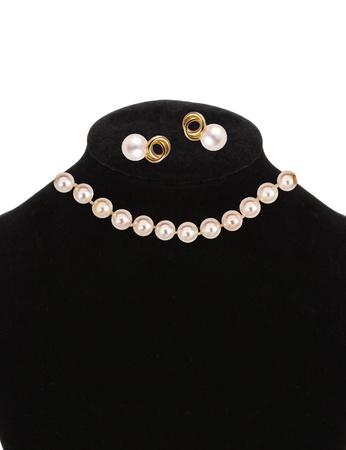 beautiful necklace and earrings with pearls isolated on whiteの写真素材