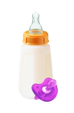 baby milk bottle and dummy isolated on white backgroundの写真素材