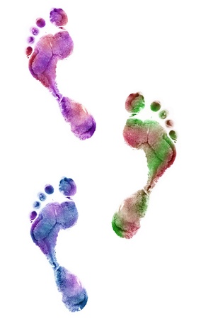 Close up of colorful foot prints isolated on white backgroundの写真素材