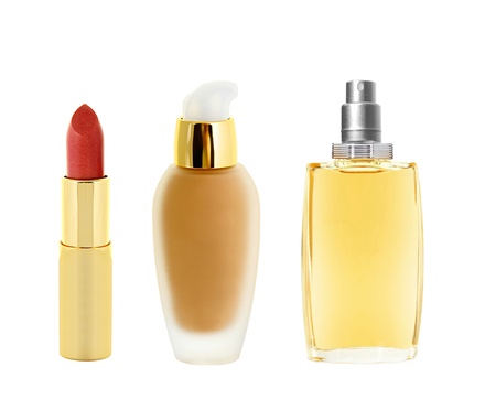 red lipstick in golden tube, makeup foundation and perfume isolated on whiteの写真素材