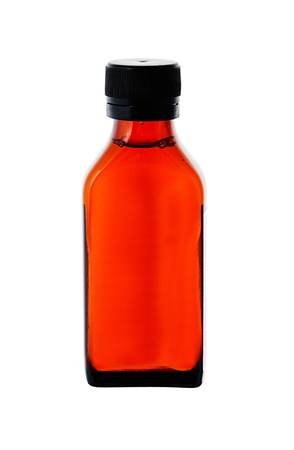 Close up on a medicine bottle with red syrup isolated on white background の写真素材