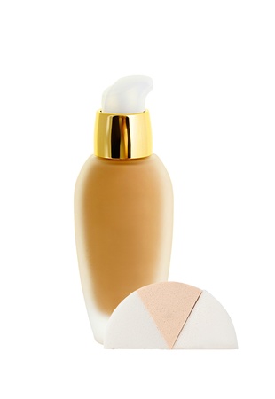 Cosmetic liquid foundation and sponges isolated on whiteの写真素材