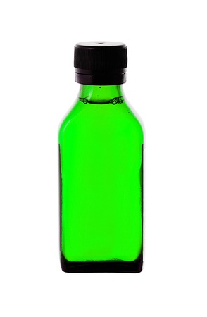 Close up of medicine bottle with green syrup isolated on white backgroundの写真素材