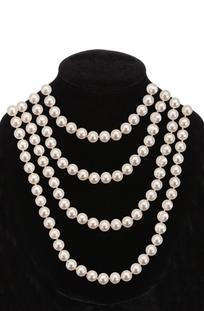 Pearl necklace on black mannequin isolated on white backgroundの写真素材