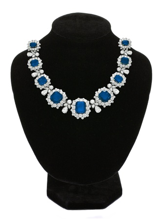 Pendant with blue gem stones on black mannequin isolated on whiteの写真素材
